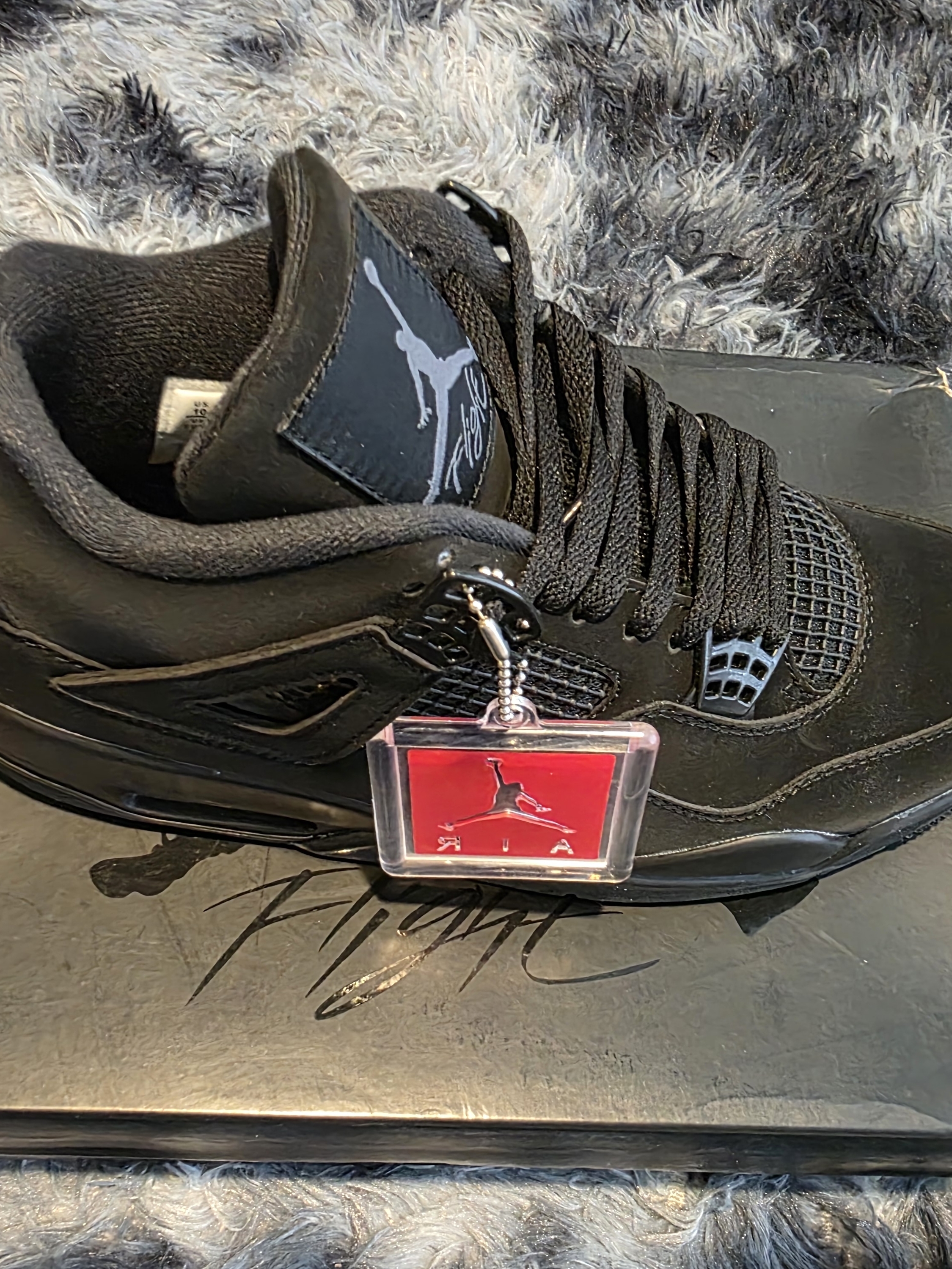 Jordan Black Sneaker With Red Jumpman Hang Tag